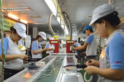 A hi-tech production line of a business in Tan Thuan Export Processing Zone, HCMC (Photo: SGGP)